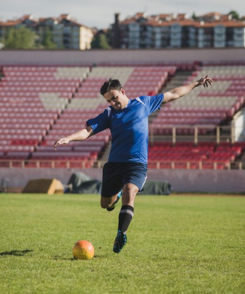 football-player-striking-free-kick
